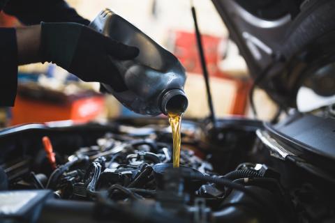 Oil being poured into car